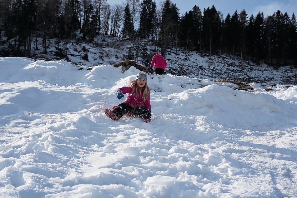 children play in deep snow