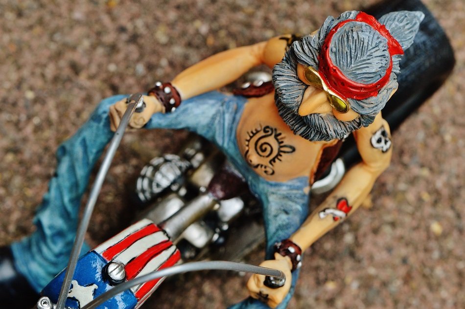 ceramic figurine of a biker on a motorcycle