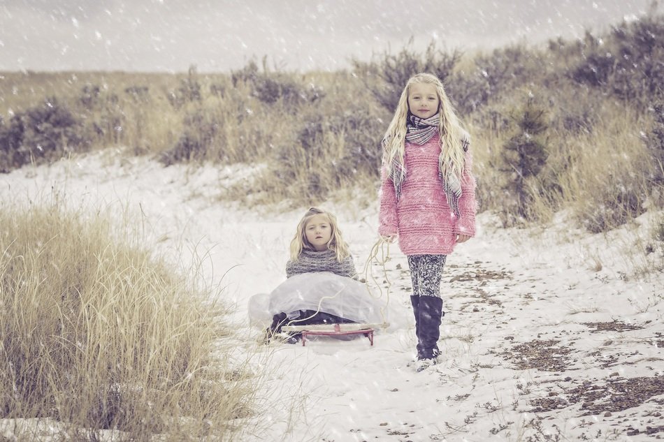 sisters walk in the snow