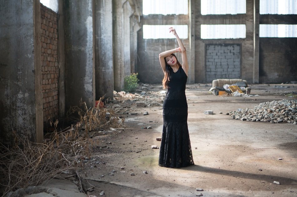 attractive asian model in the abandoned plant