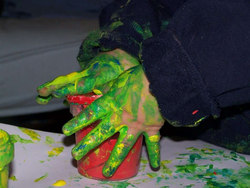 green Paint on the hands