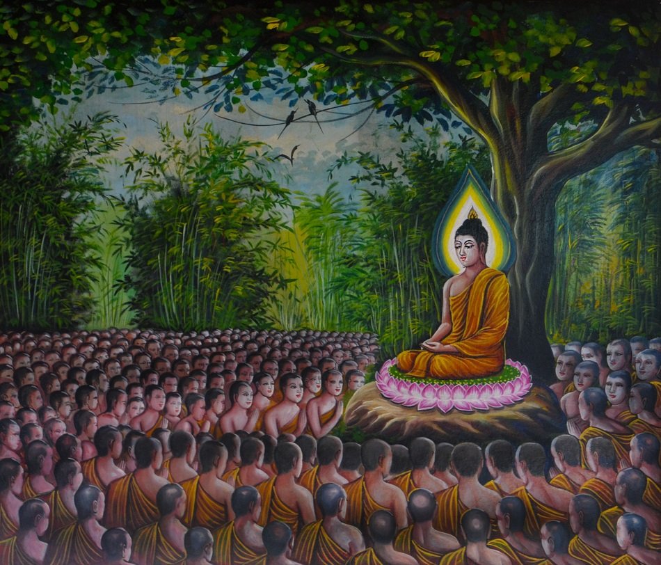 crowd of people around the buddha statue