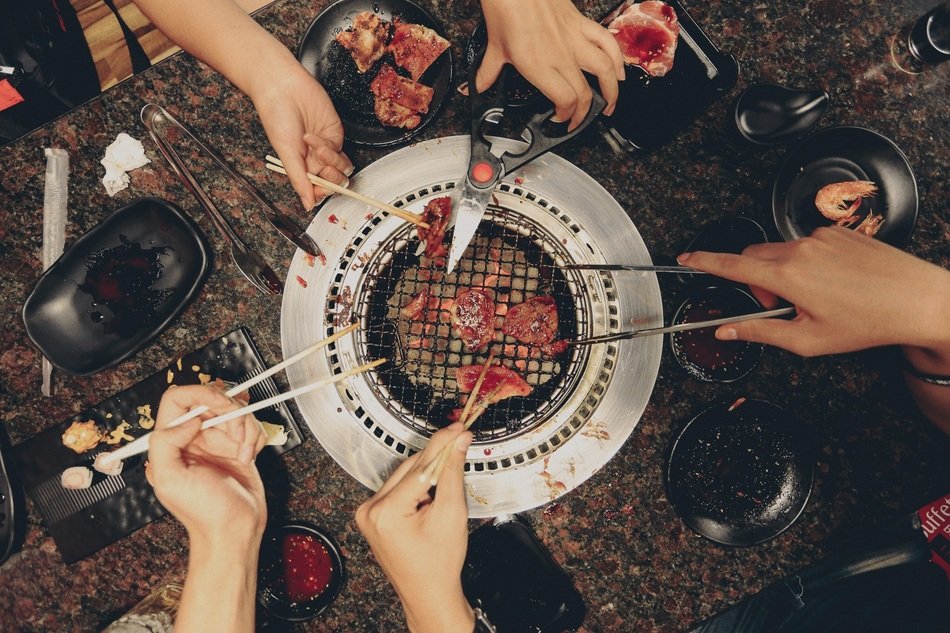 friends gathered at the family grill