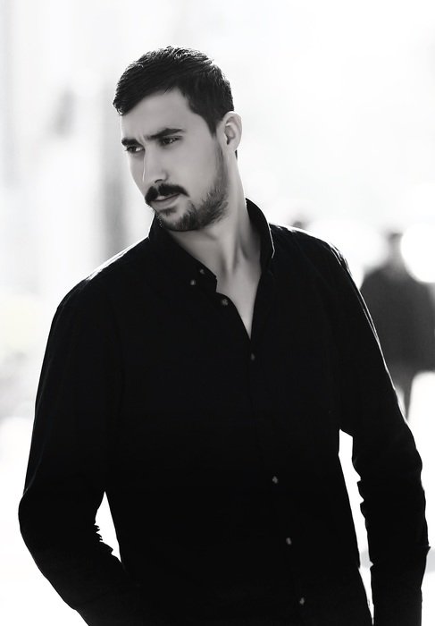 young turkish man in black