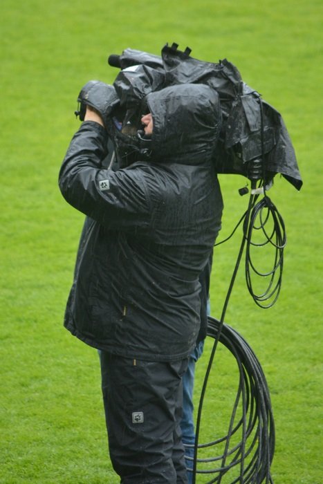 picture of filming operator in the rain