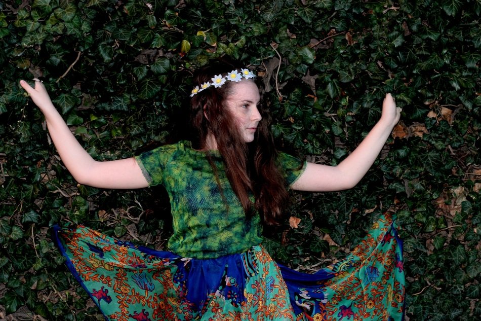 portrait of girl like the wind on a background of green