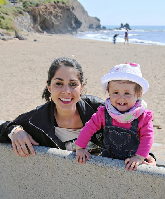 Mom and Child on the sand near the water