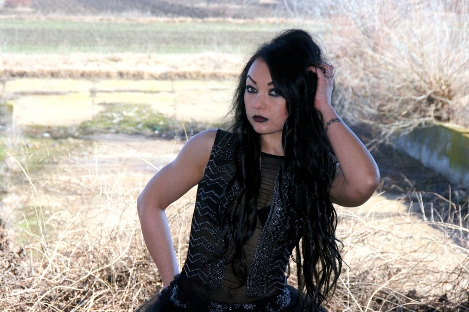 girl in black among nature