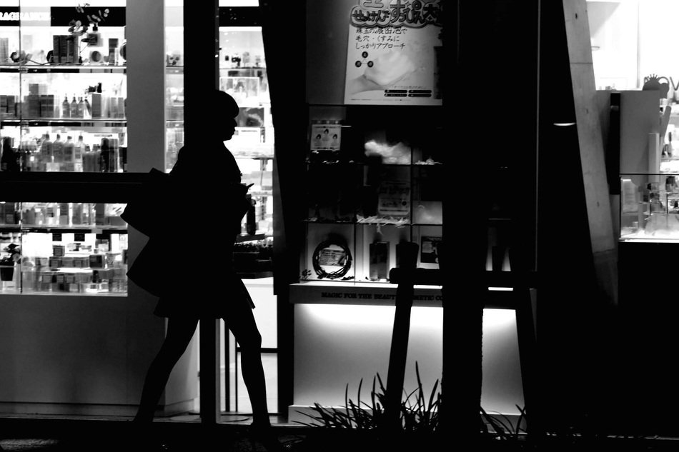 black and white photo of a girl outdoors in Osaka Japan
