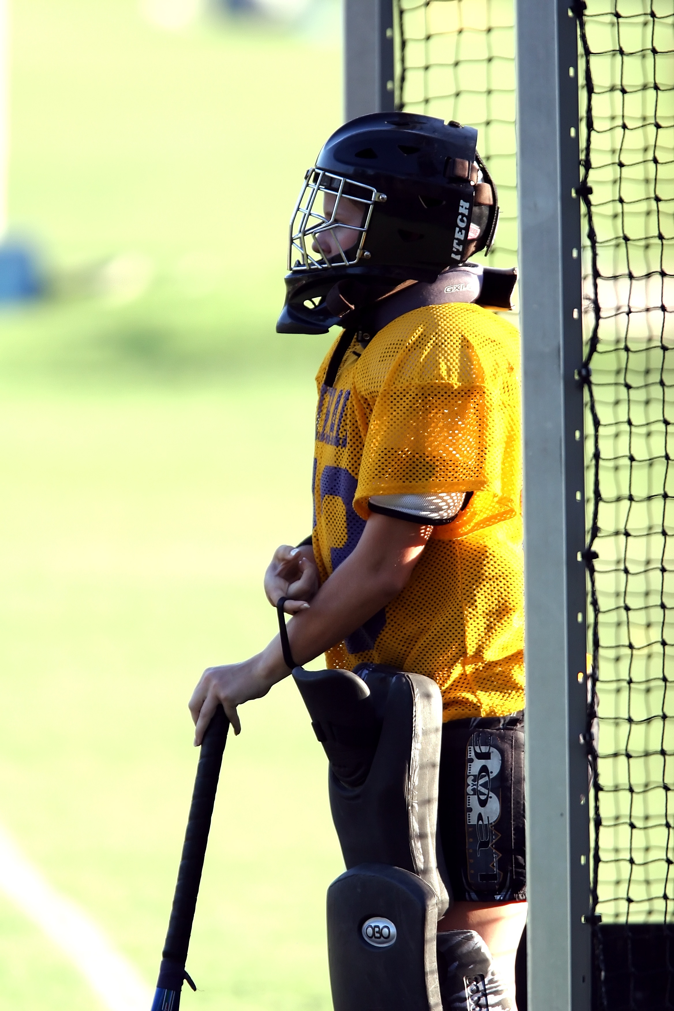 Goalkeeper in helmet, field hockey free image download