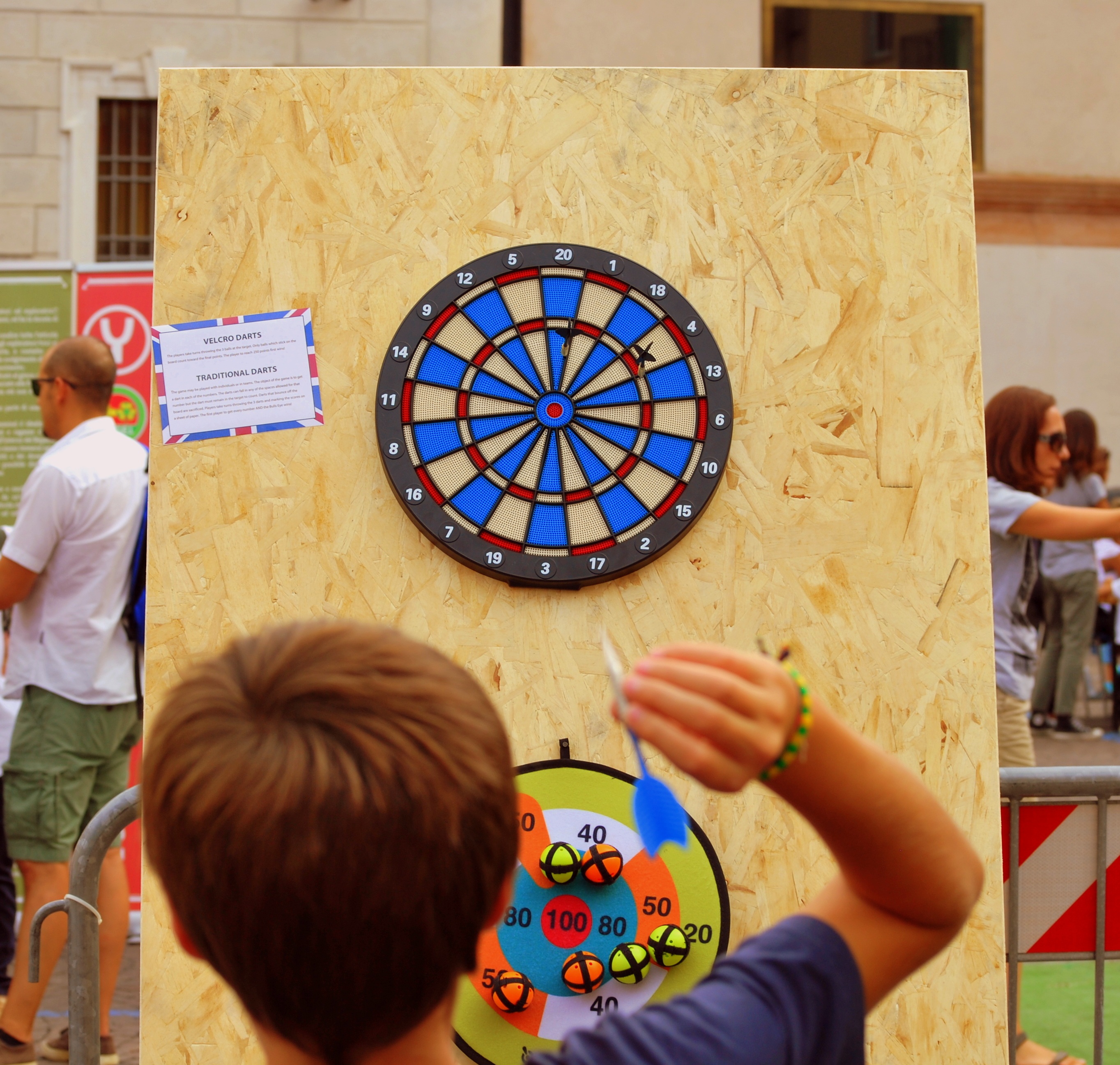 Boy Is Playing Darts On The Street In Verona Free Image Download