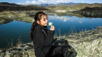 romantic little girl on the background of the lake in Kalavasos, Cyprus