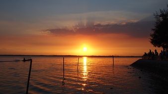 golden sunset over the water surface in Dong Hoi, Vietnam