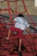 child on the ropes at the playground