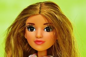 brown eyes and pink lips a doll with long hair