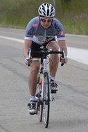 athlete in a helmet on a bicycle