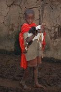 boy with goat in kenyan village