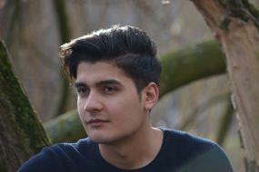 a young man near the tree