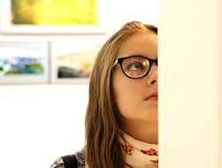 girl with glasses in an art gallery