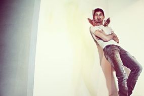 Angels sitting on a man