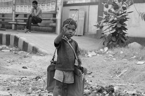 poor hungry child in the street