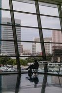 man sitting on a chair by the panoramic window
