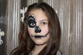 little girl with makeup for Halloween