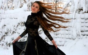 girl in black among a winter tale