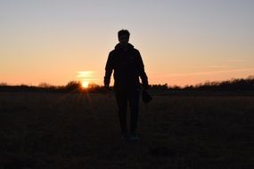 Silhouette of the person and sunset