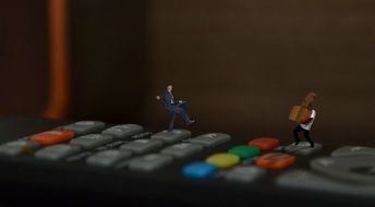 clipart of mini people on the remote