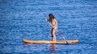 woman on the paddle board at summer