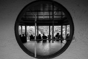 Black And White photo of sitting people