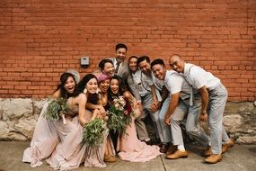 photo of asian wedding on brick wall background