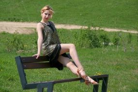 girl in a vintage dress on a bench