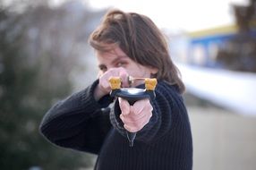 girl aiming a slingshot