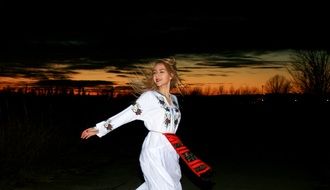 blonde in traditional Romanian costume
