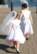 two flowergirls walking together