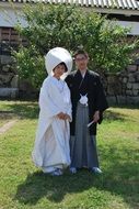 people dressed in traditional japanese outfits