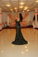 girl in a luxurious long dress in a restaurant