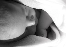 sleeping baby in black and white image