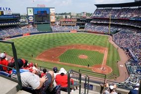 fans at the stadium at a baseball game