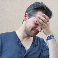 portrait of an unhappy and stressed man