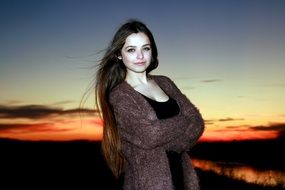 beautiful girl with long hair at sunset