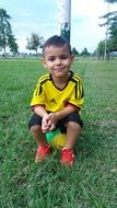 little boy on the football field