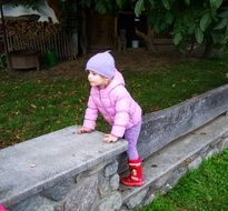 Toddler in a pink coat