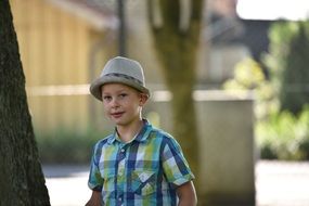 young boy in a gray hat