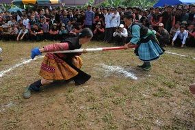 girls with a rope on a village holiday