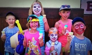 Happy children with the ice cream on holidays