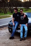 friends near a black car