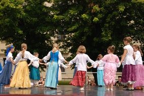 costumed Child girl Dancing Folk Dance outdoor, poland, krakow